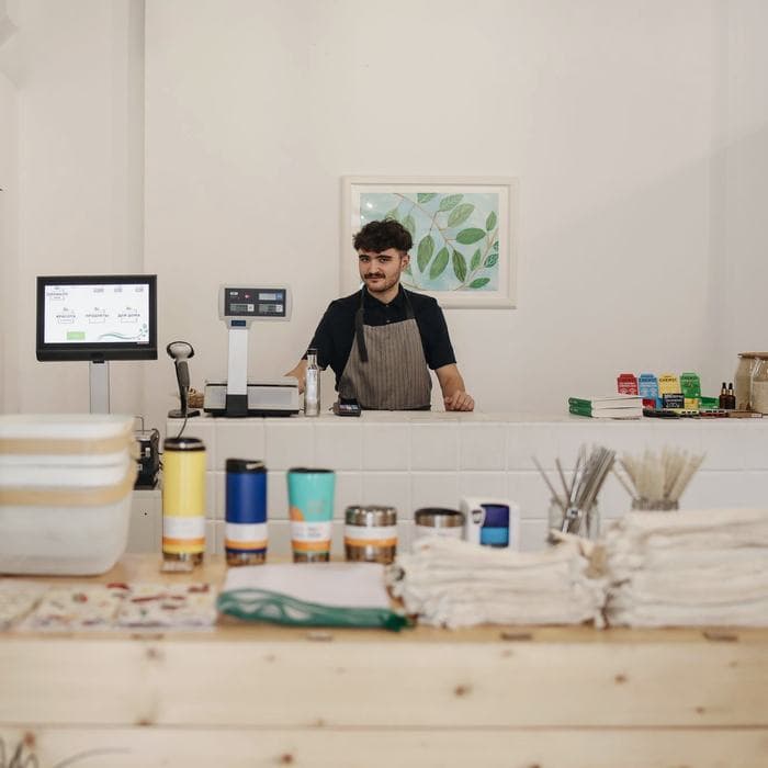 Shop owner working behind the counter
