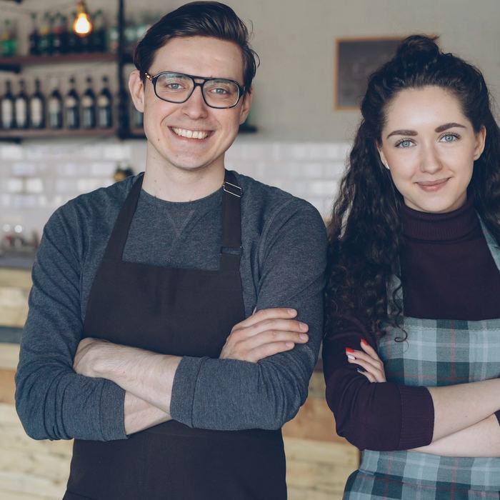 Two cafe owners in their venue