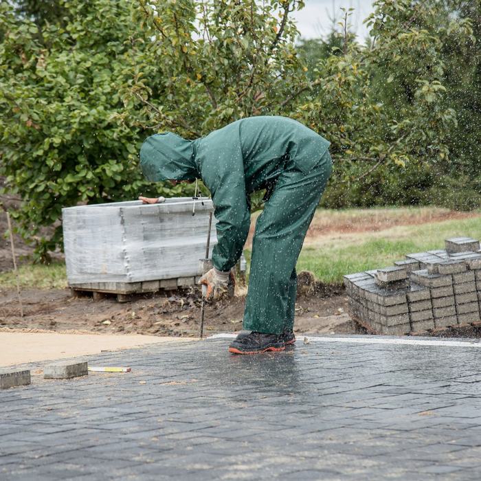 Landscaper laying paving