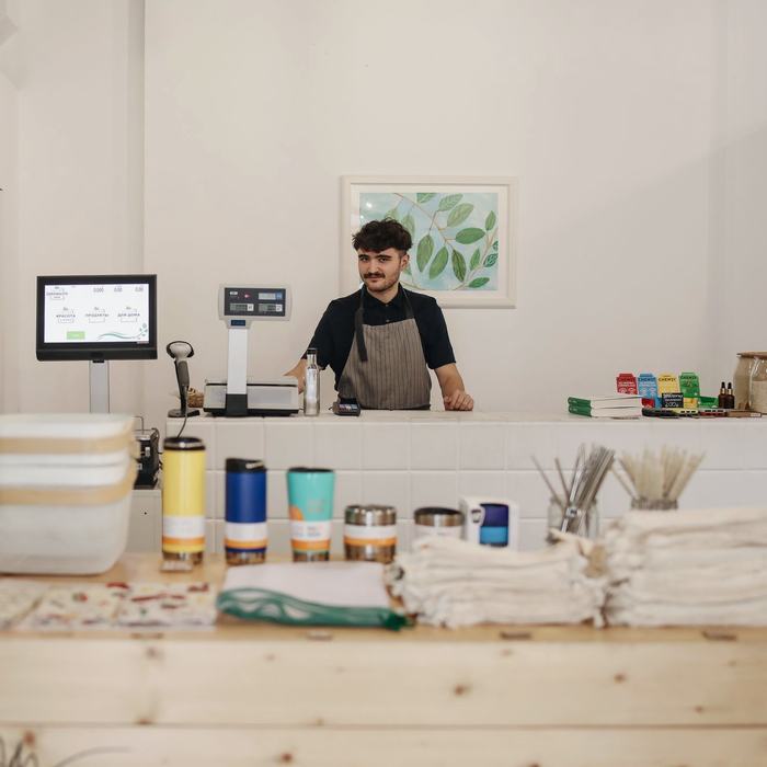 Shop owner working behind the counter