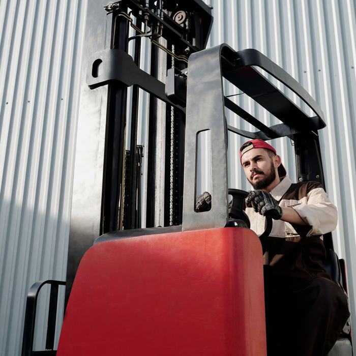 Forklift operator in a warehouse