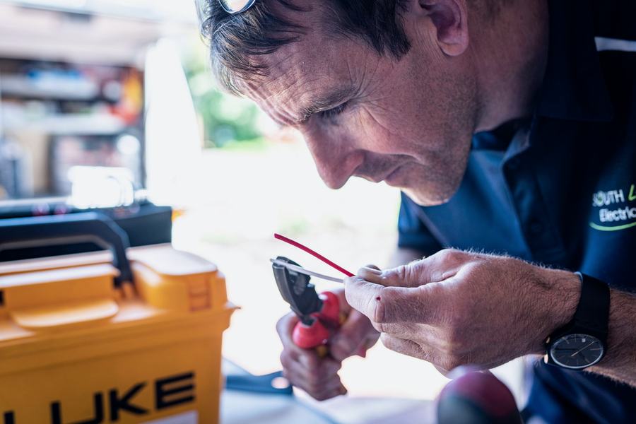Electrician working on equipment